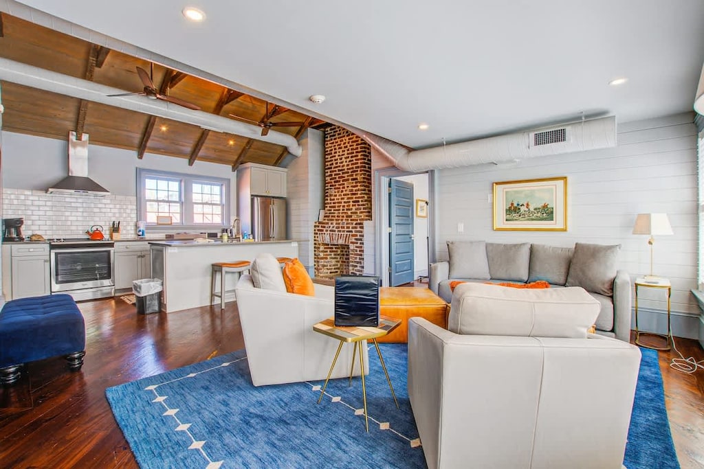 Spacious living room with seating for your entire group + kitchen with island seating for two