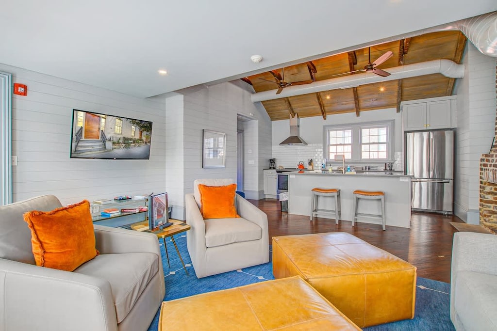 Spacious living room with seating for your entire group + kitchen with island seating for two