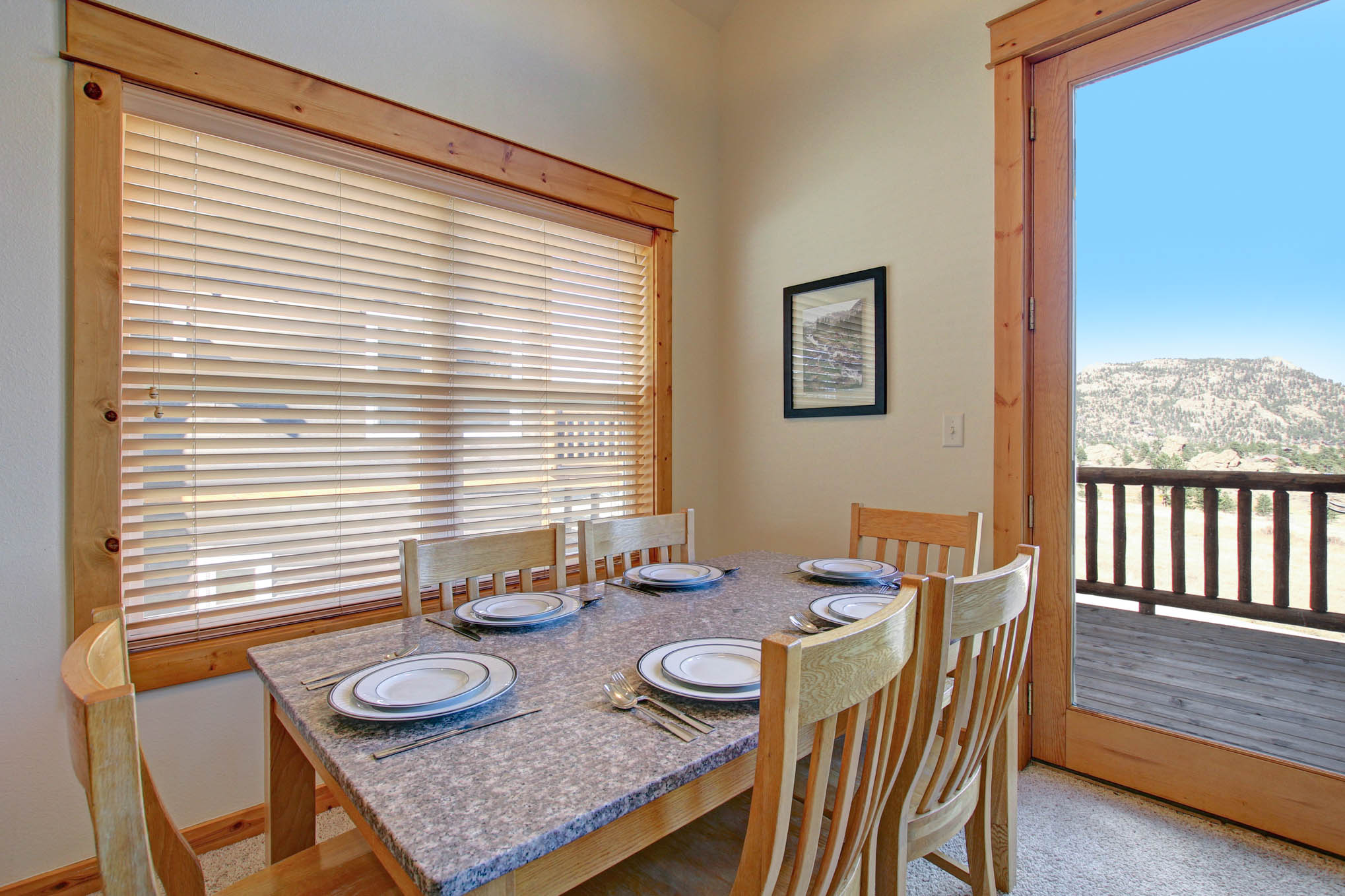 Dining table with seating for six, window opens up to stunning mountain views.