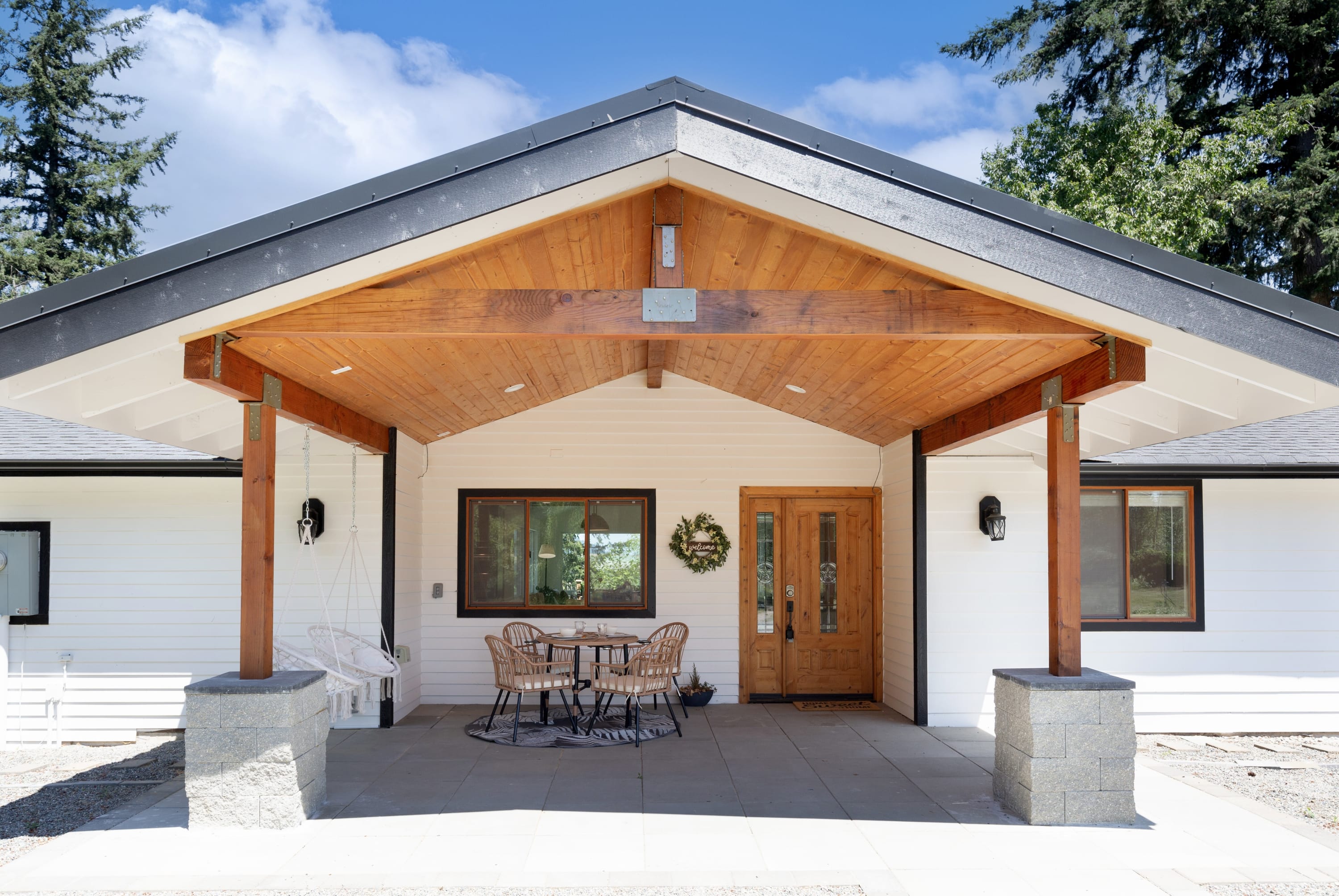 Welcome to our charming porch! Perfect for a relaxing meal or evening conversations with friends.