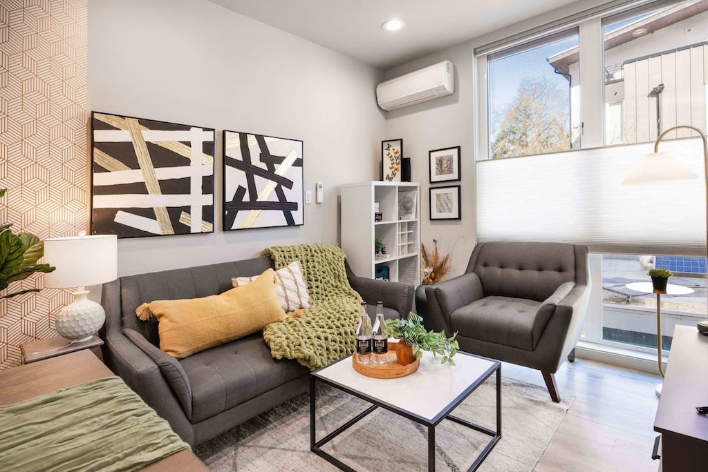 Welcome to our inviting living room with bright natural light