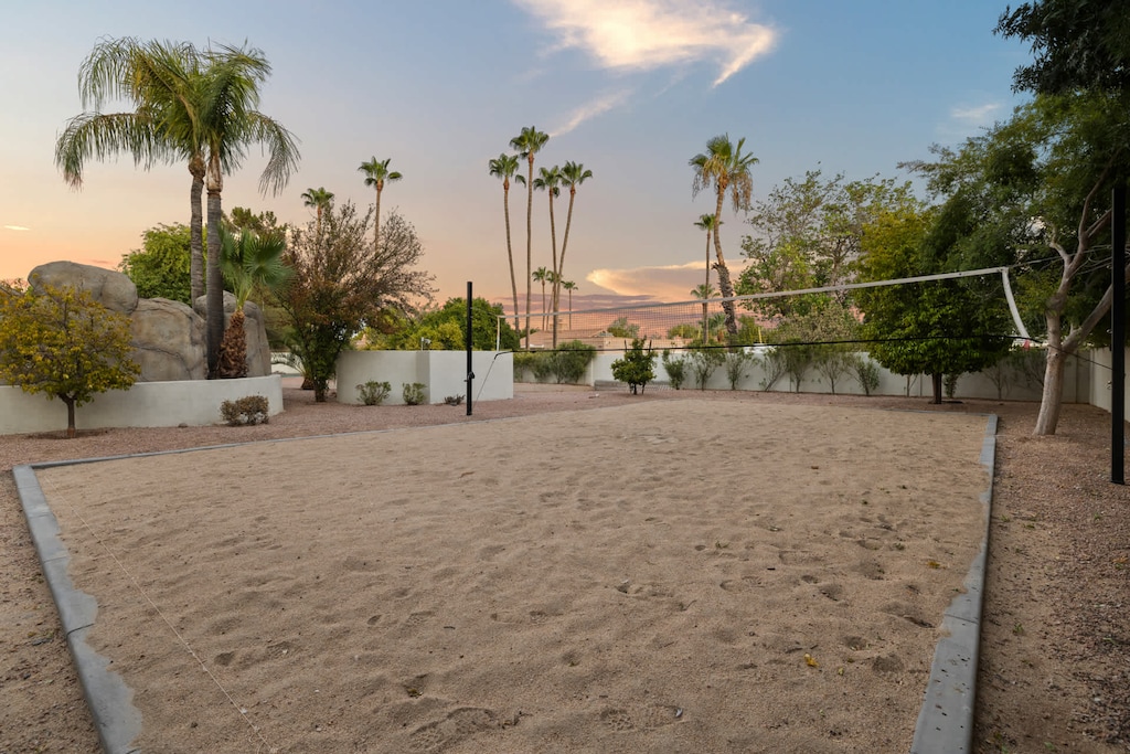 Full size sand volleyball court nestled into our resort style backyard.