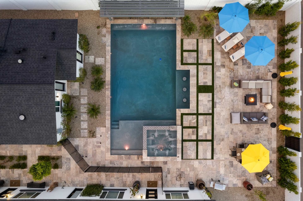 Montecito Luxe Pool Courtyard with pool, spa, fire pit, lounge chairs and dining area.