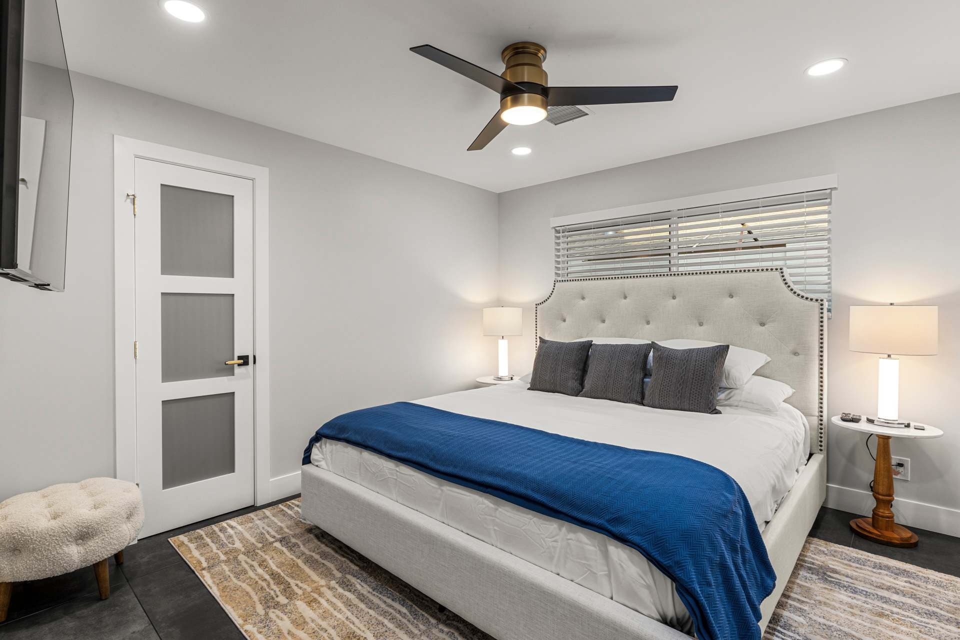 Casa Principal master bedroom with plush headboard.
