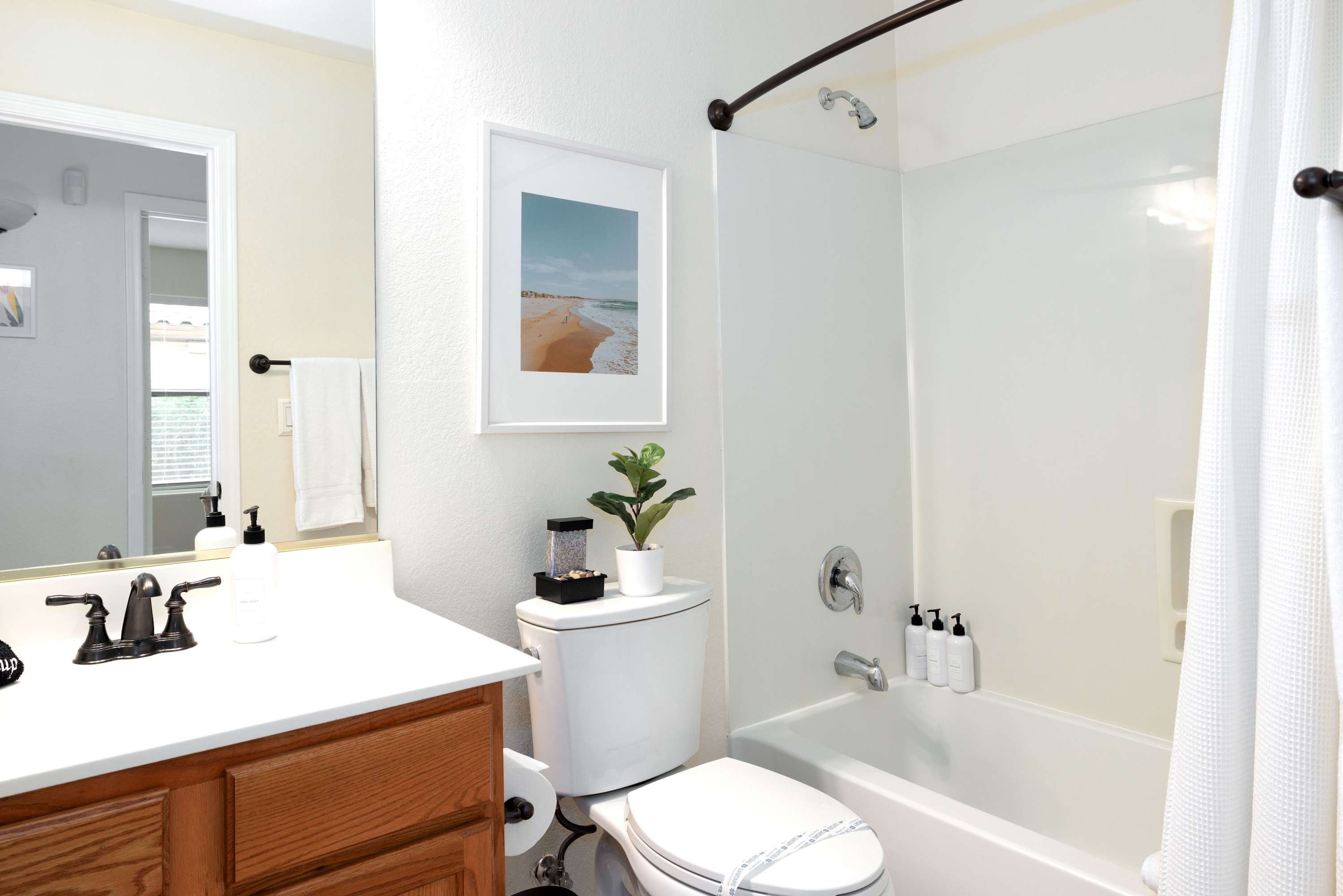 Clean and modern bathroom with neatly organized toiletries. Clean and modern bathroom with neatly organized toiletries.