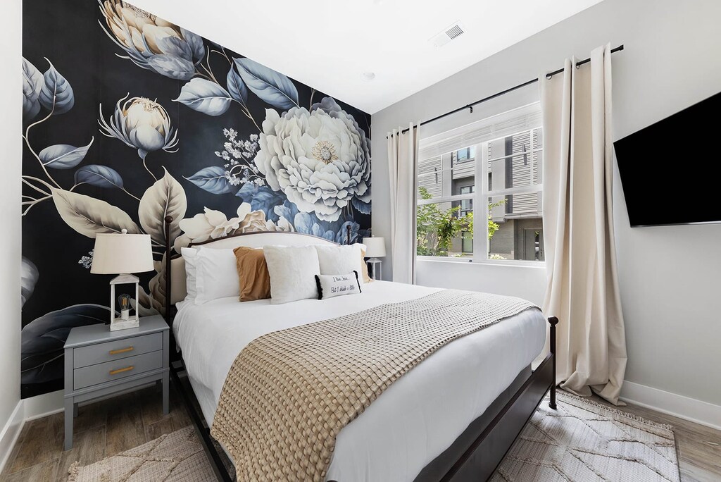 Immaculate Bedroom with Luxury Linens and Cozy Touches
