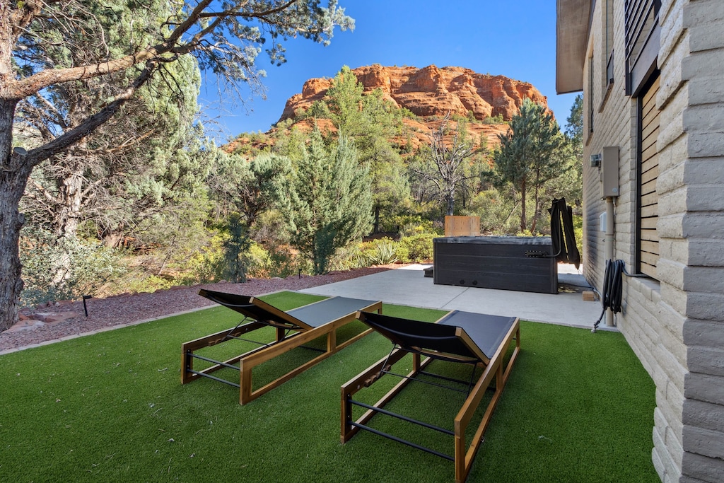 Synthetic grass with chaise lounges perfect for laying out