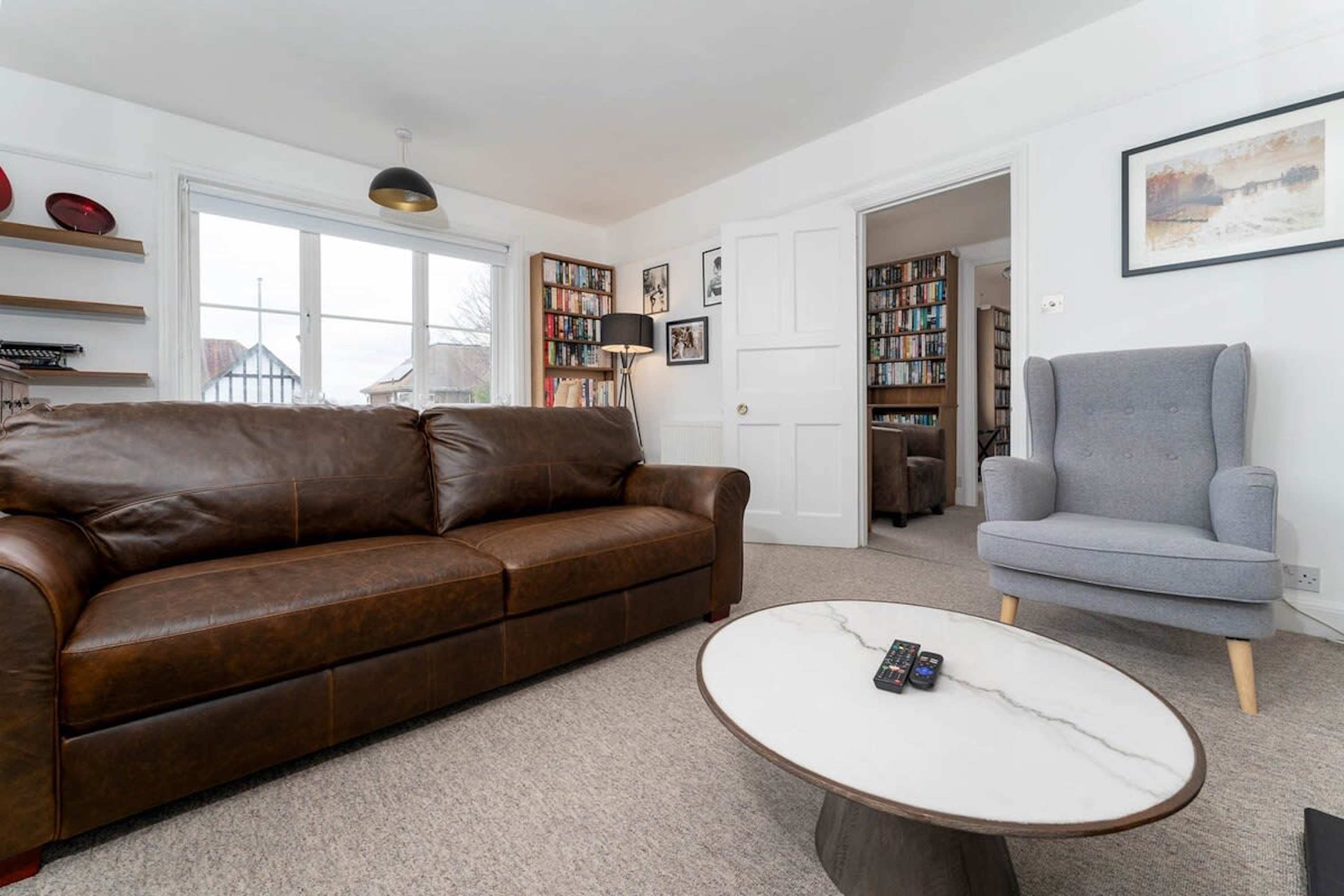 Living room lit with natural light perfect for a relaxing evening. 