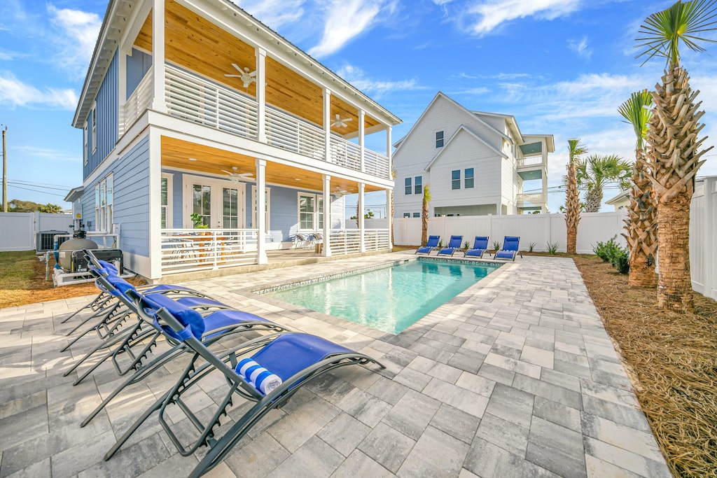 Head to the shore or stay home to relax in your stunning backyard pool.