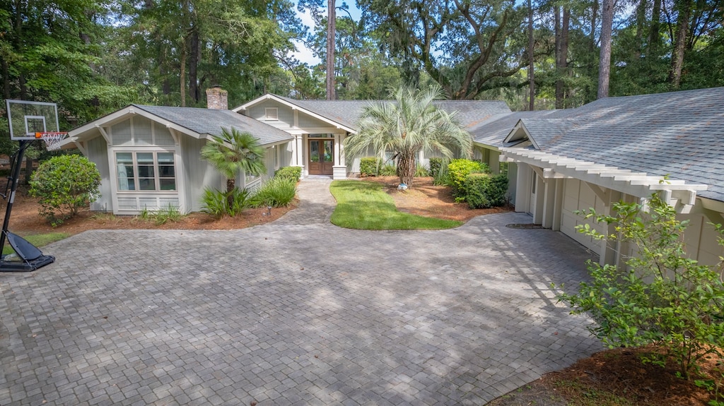 The  garage adds convenience and curb appeal, while the quiet, wooded setting creates a private and relaxed first impression.