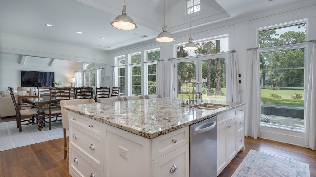 The open layout flows into the dining and living areas, offering a bright, connected space ideal for gatherings.