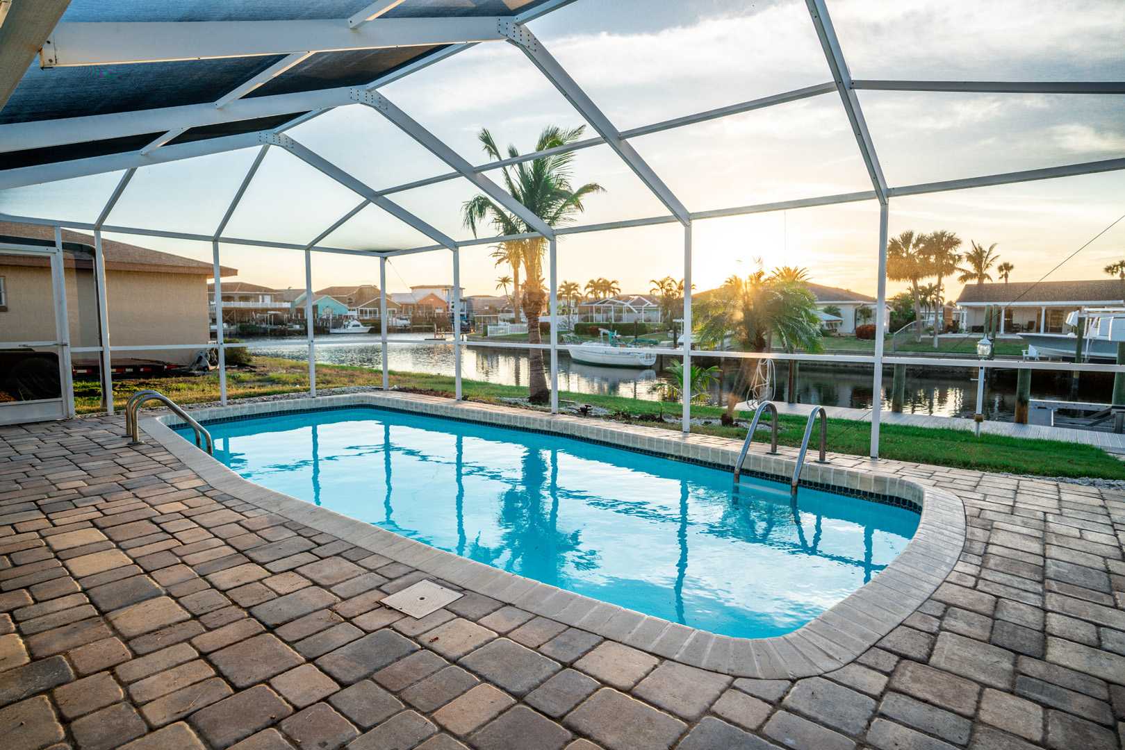 Feel the breeze and enjoy the views—our screened pool is the ultimate waterfront getaway