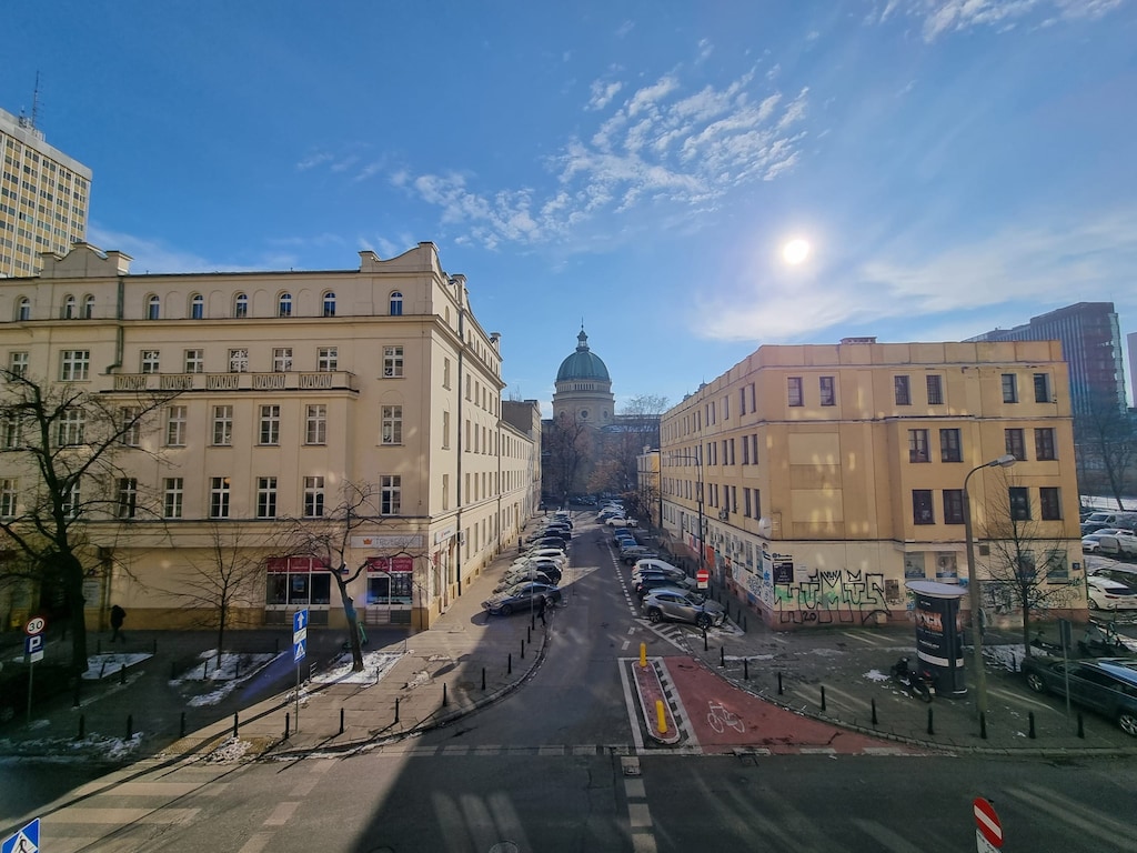 A picturesque street view of a historical building under a clear blue sky.
