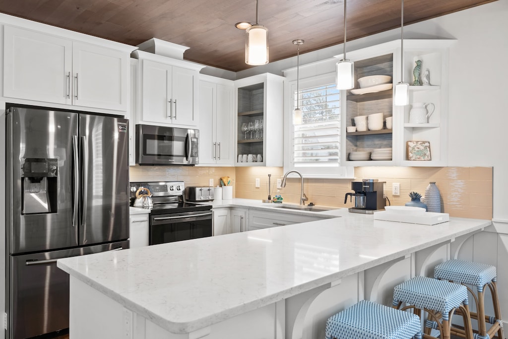 Barstool seating at the kitchen island.