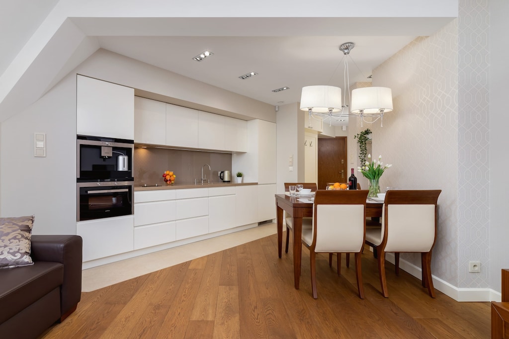 Large table with chairs for eating communal meals. 