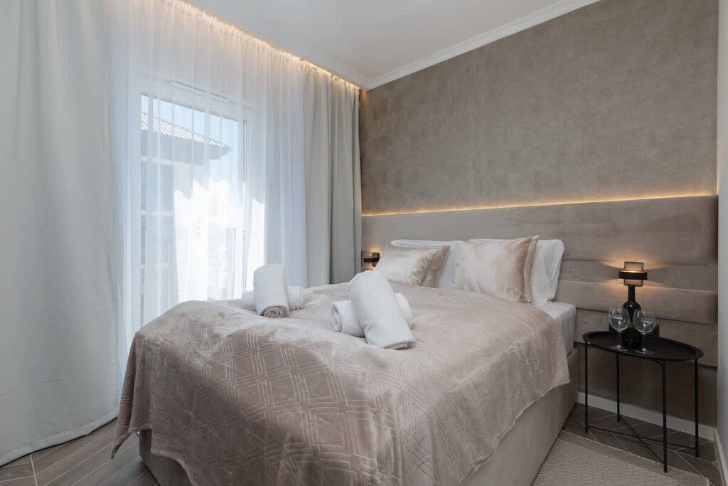 The bedroom's elegant decor creates a serene and restful environment.