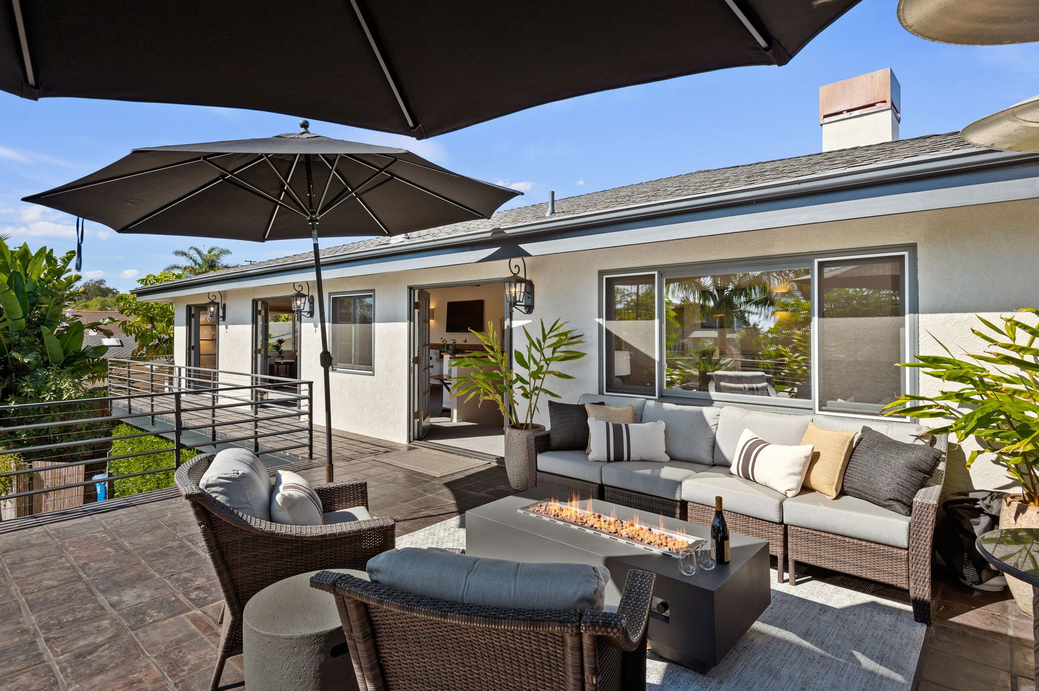 The oversized balcony, through the French Doors of the game room, offers ample seating and a large fire pit to lounge at The oversized balcony, through the French Doors of the game room, offers ample seating and a large fire pit to lounge at