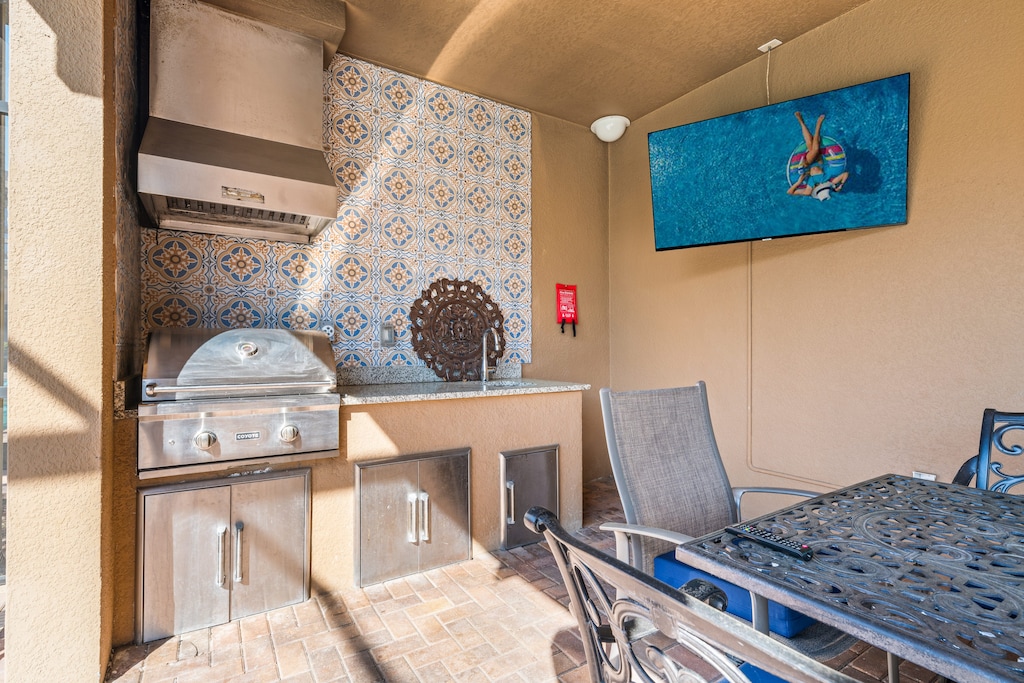 The house features  its own private pool, BBQ grill, spacious dining setup, and a TV.