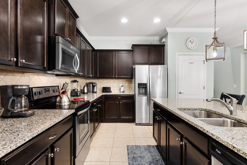 The kitchen features stainless steel appliances with all you need to prepare delicious meals.
