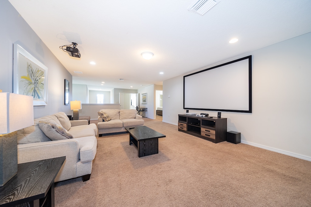 Gather the whole family for a cozy movie night in our spacious TV room, complete with ample plush seating for everyone to relax and enjoy.