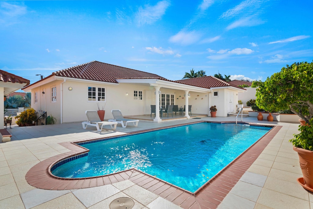 - Bask in the beauty of this stunning poolside retreat, made for ultimate relaxation - Soothing waters and serene surroundings invite you to recharge in pure comfort - Whether lounging or splashing, this is where fun meets tranquility