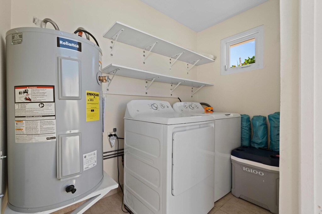 - A tidy and efficient laundry room equipped with a washer, dryer, and plenty of storage - Bright and well-organized, perfect for handling all your laundry needs - A practical space that keeps your vacation stress-free and convenient