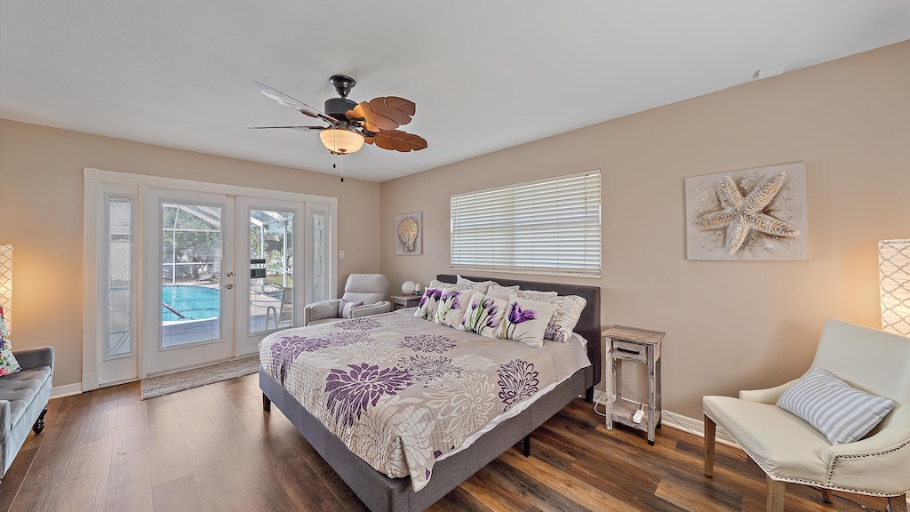 Retreat to the tranquil Primary Bedroom featuring a cozy Queen bed and private French doors leading directly to the stunning pool patio for an easy morning swim.