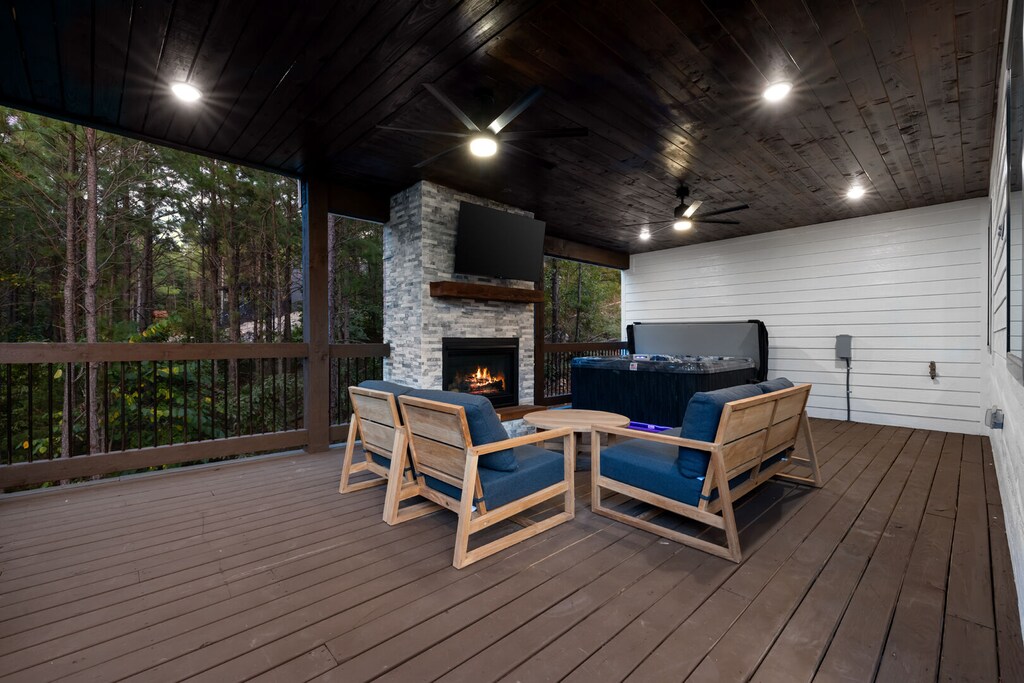 Outdoor deck with hot tub on other side