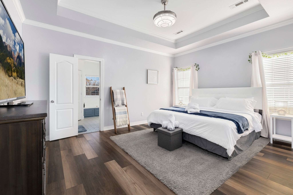 Our primary bedroom features a King size bed, Smart TV, and an attached private bathroom with a shower and large jacuzzi tub.