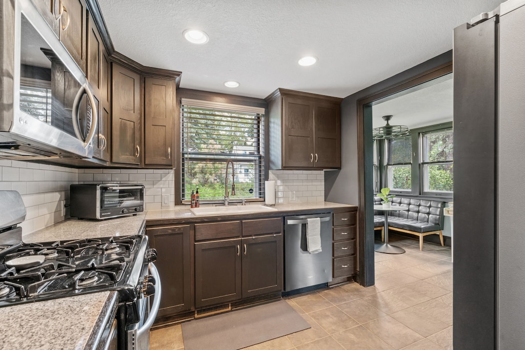 Your fully equipped kitchen features rich wood cabinets, granite counters, and stainless appliances for cooking memorable meals.