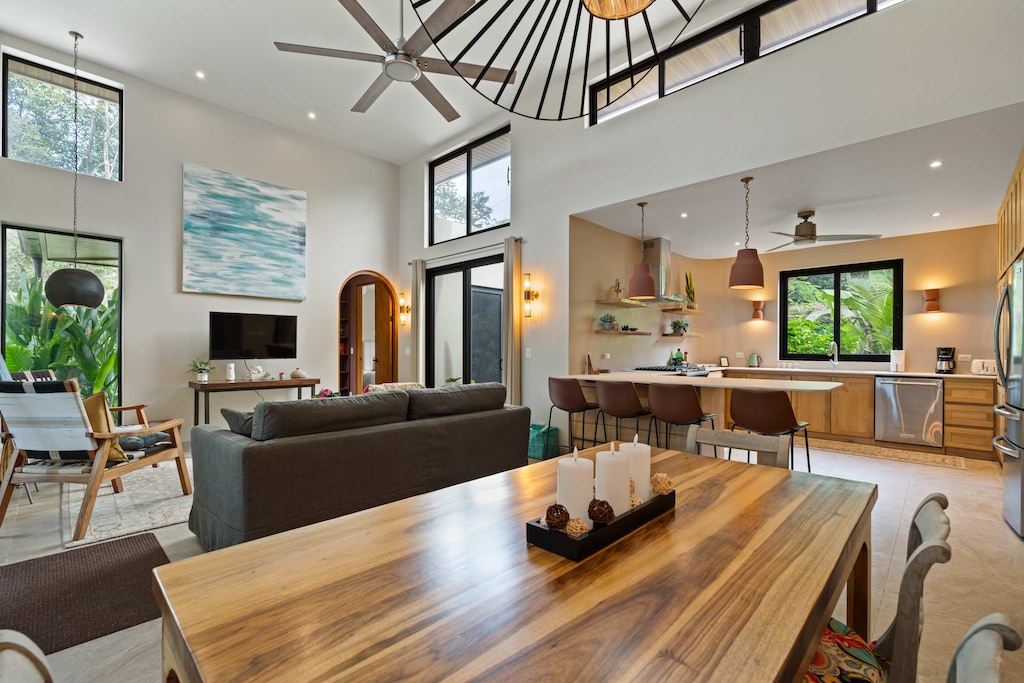 Open Concept Area with Dining Table, Living Room and Kitchen