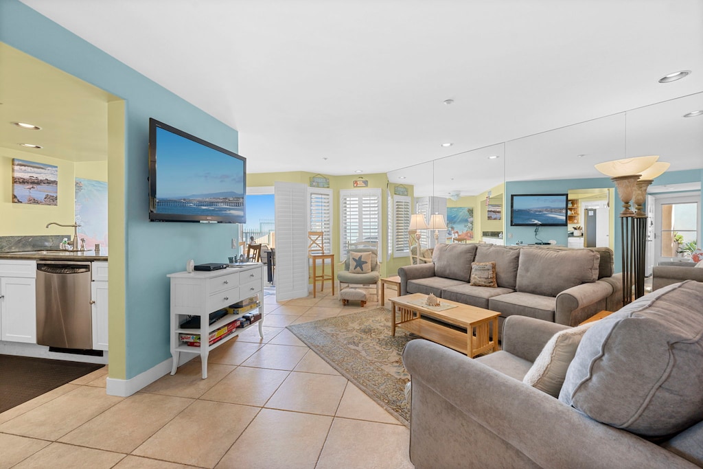 The living room features a queen-sized sofa bed