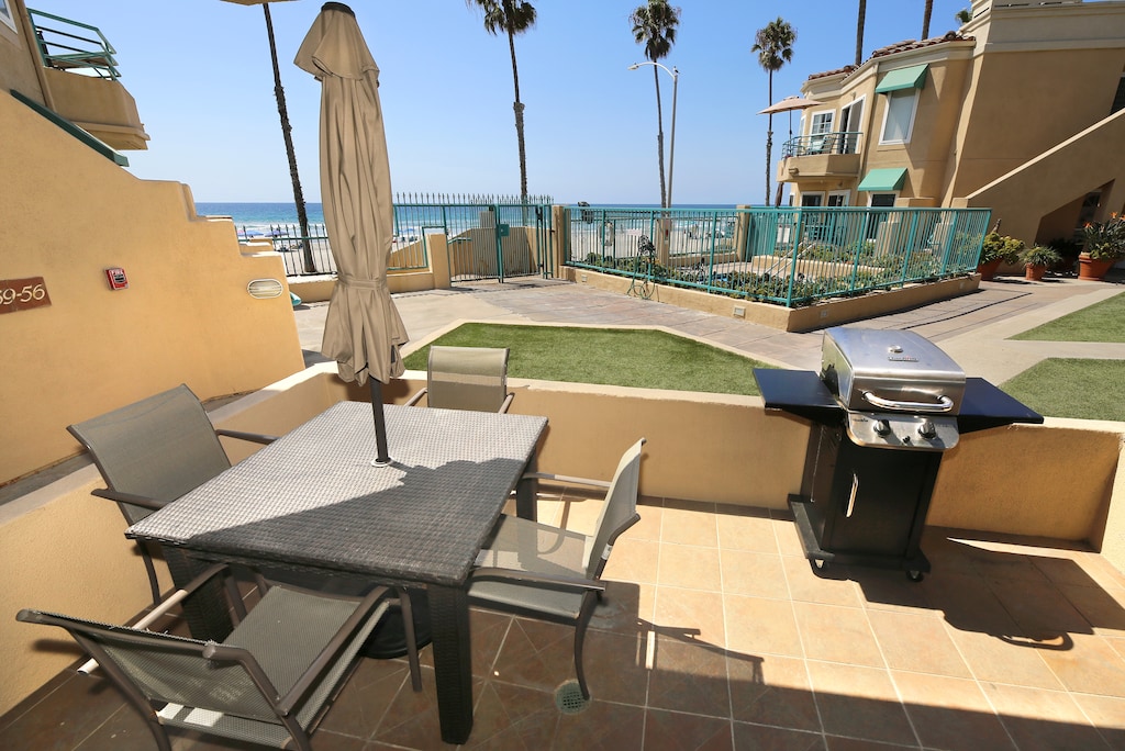 A spacious dining table on the patio that seats 4