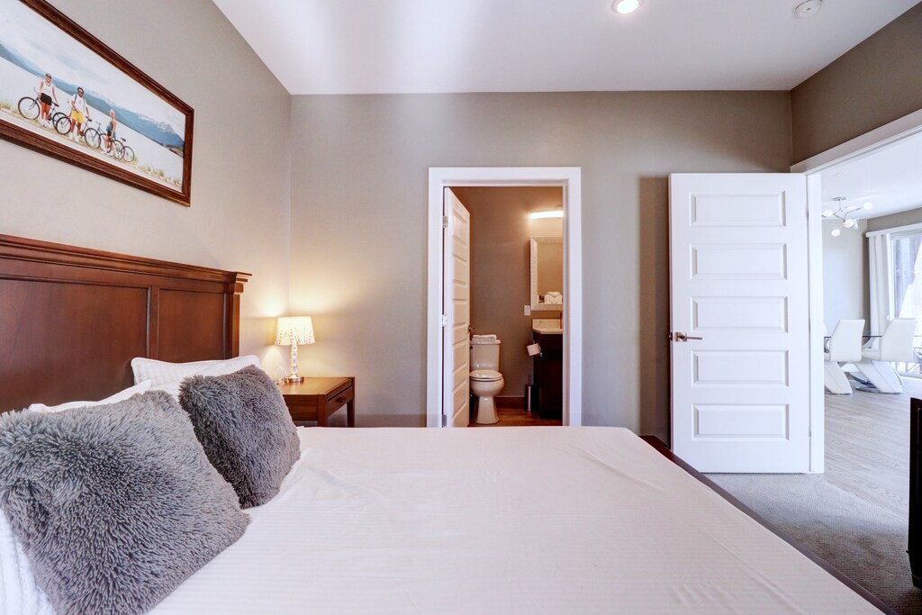 Master bedroom features an attached bathroom.