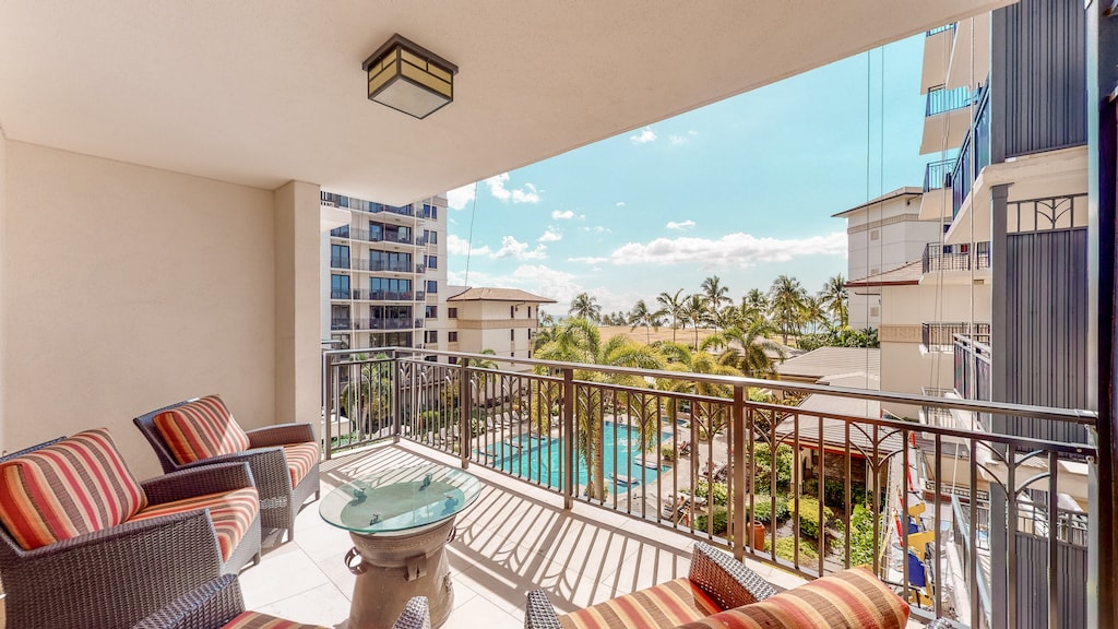 Relax on Ko Olina Beach Villas O401's lanai with breathtaking views of the pool and lush island scenery.