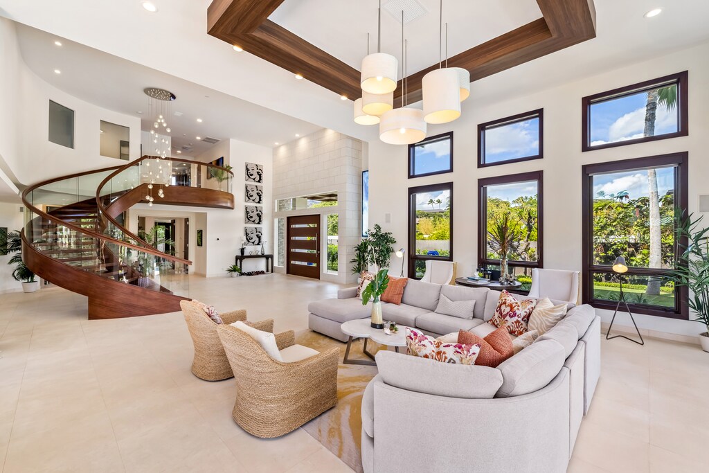 Elegant living area with comfortable seating and views of the tropical garden.