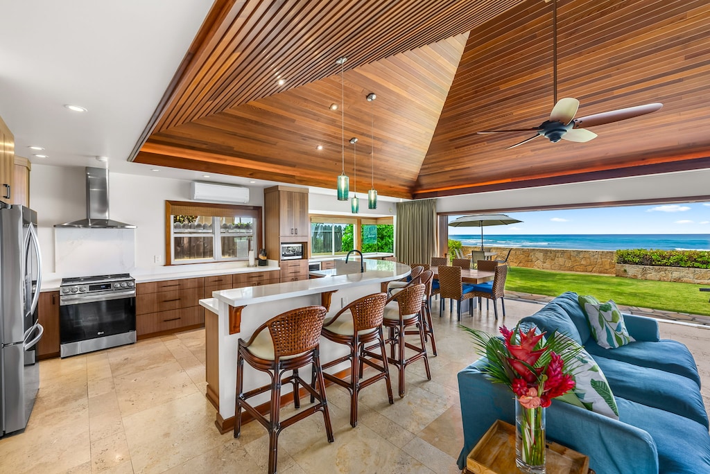 The open living space flows effortlessly into the oceanside yard, creating a seamless indoor-outdoor experience.