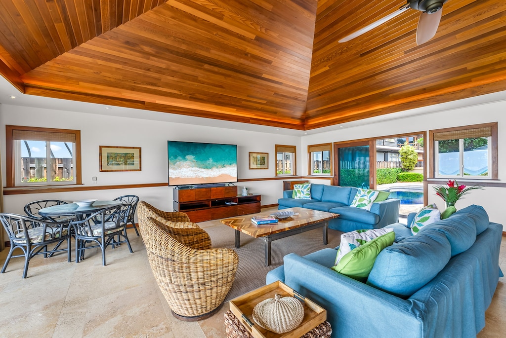 A beautifully curated living area featuring rattan accents and plush seating, bathed in natural light.