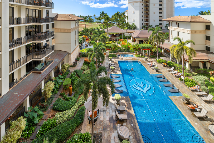 Resort pool view from the lanai with a glimpse of the ocean