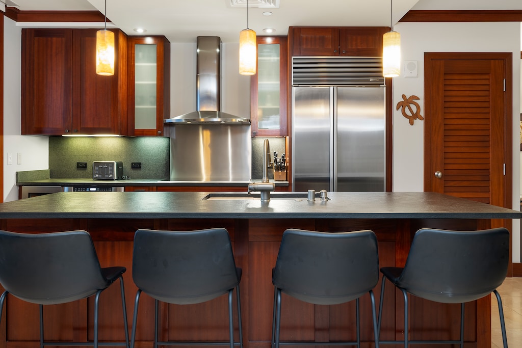 Alternate View of Kitchen with top of the line appliances and breakfast bar.