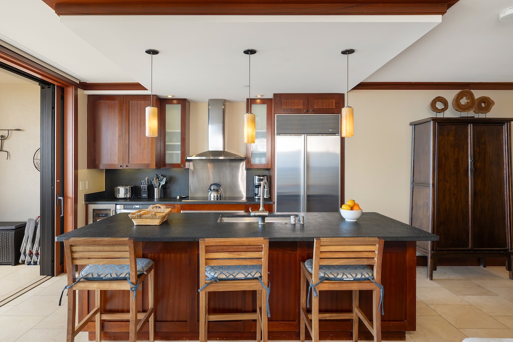 A large island with seating in the kitchen is perfect for casual meals and socializing.