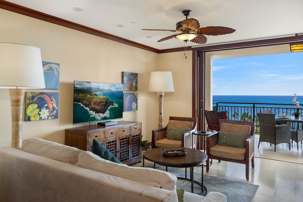 The living area has direct access to the lanai and ocean views.
