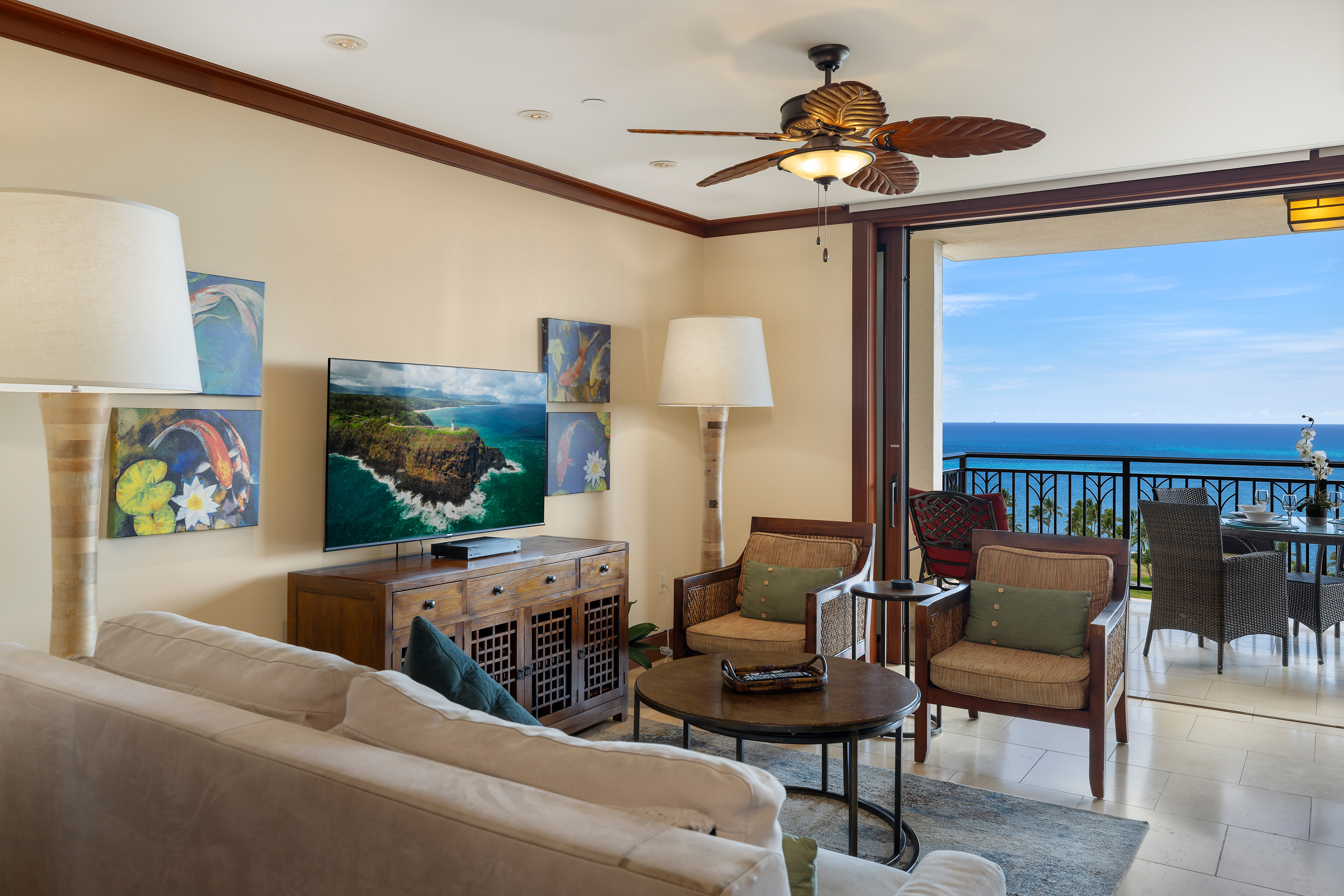 The living area has direct access to the lanai and ocean views.