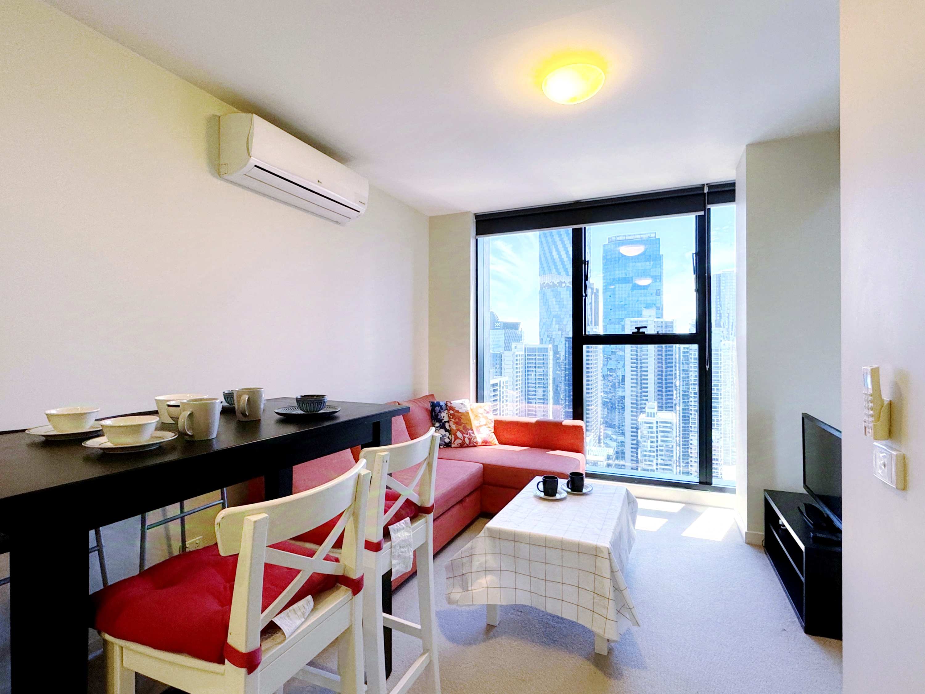 Living area with a smart TV, perfect for entertainment Living area with a smart TV, perfect for entertainment