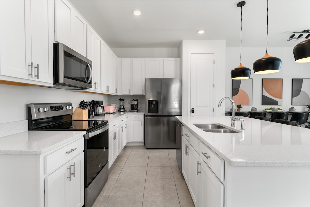 The kitchen features stainless steel appliances with all you need to prepare delicious meals.