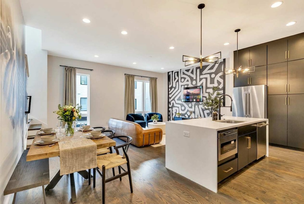 Discover the vibrant energy of Downtown Nashville in this stylish vacation rental. Gather around the elegant dining table or relax in the plush living area, ideal for large groups. Enjoy modern amenities in a space that captures Music City’s sophisticated vibe—your upscale getaway awaits.