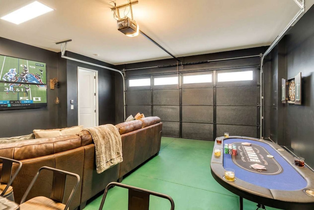 Unwind and play in this stylish game room, perfect for your Nashville getaway! With a poker table, darts, and a cozy couch, it's ideal for group fun. Experience Nashville’s charm with Misfit Homes. Reserve your stay today!