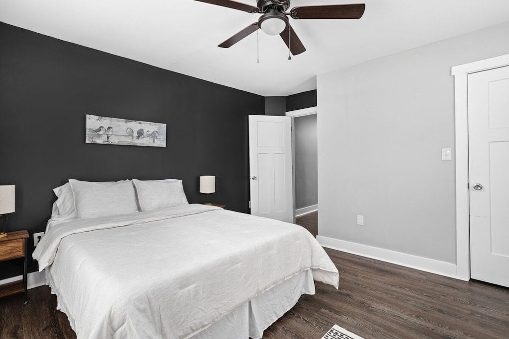 2nd Bedroom: Relax in plush bedding under a stylish ceiling fan with chic decor and serene vibes!