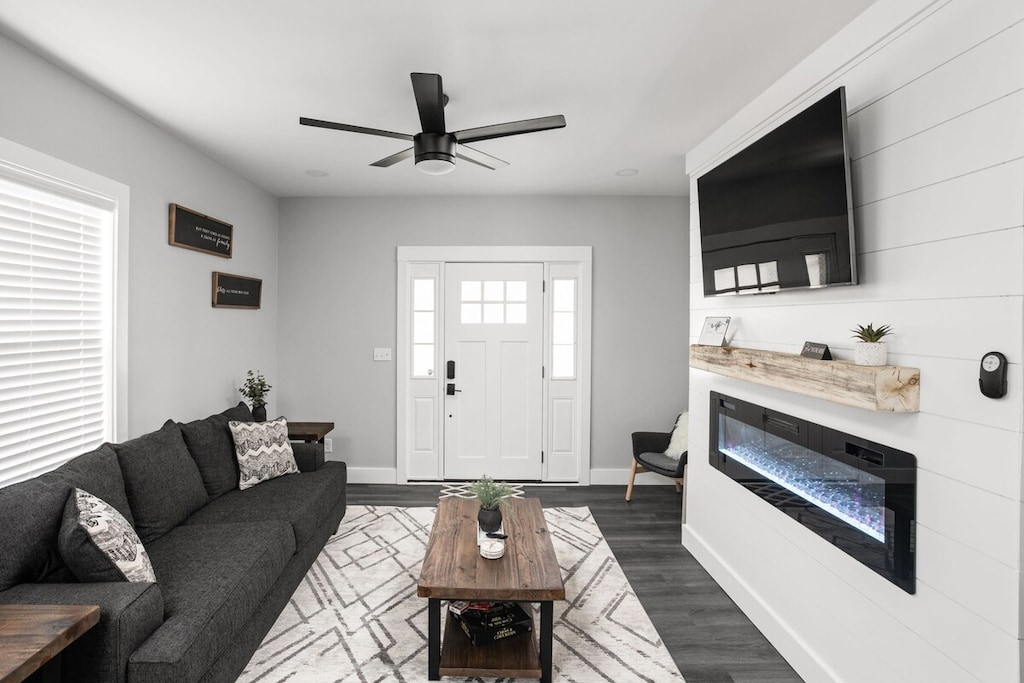 Living Room: Bright and stylish space with sleek furniture, a flickering fireplace, and vibrant decor!