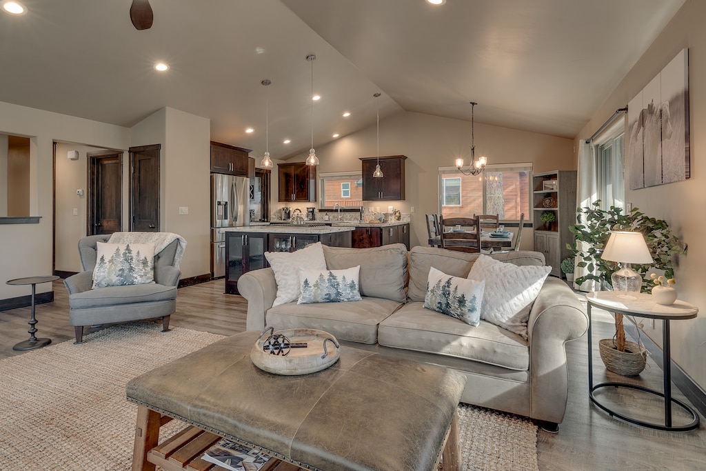 Living area with sectional sofa, flat screen TV and fireplace